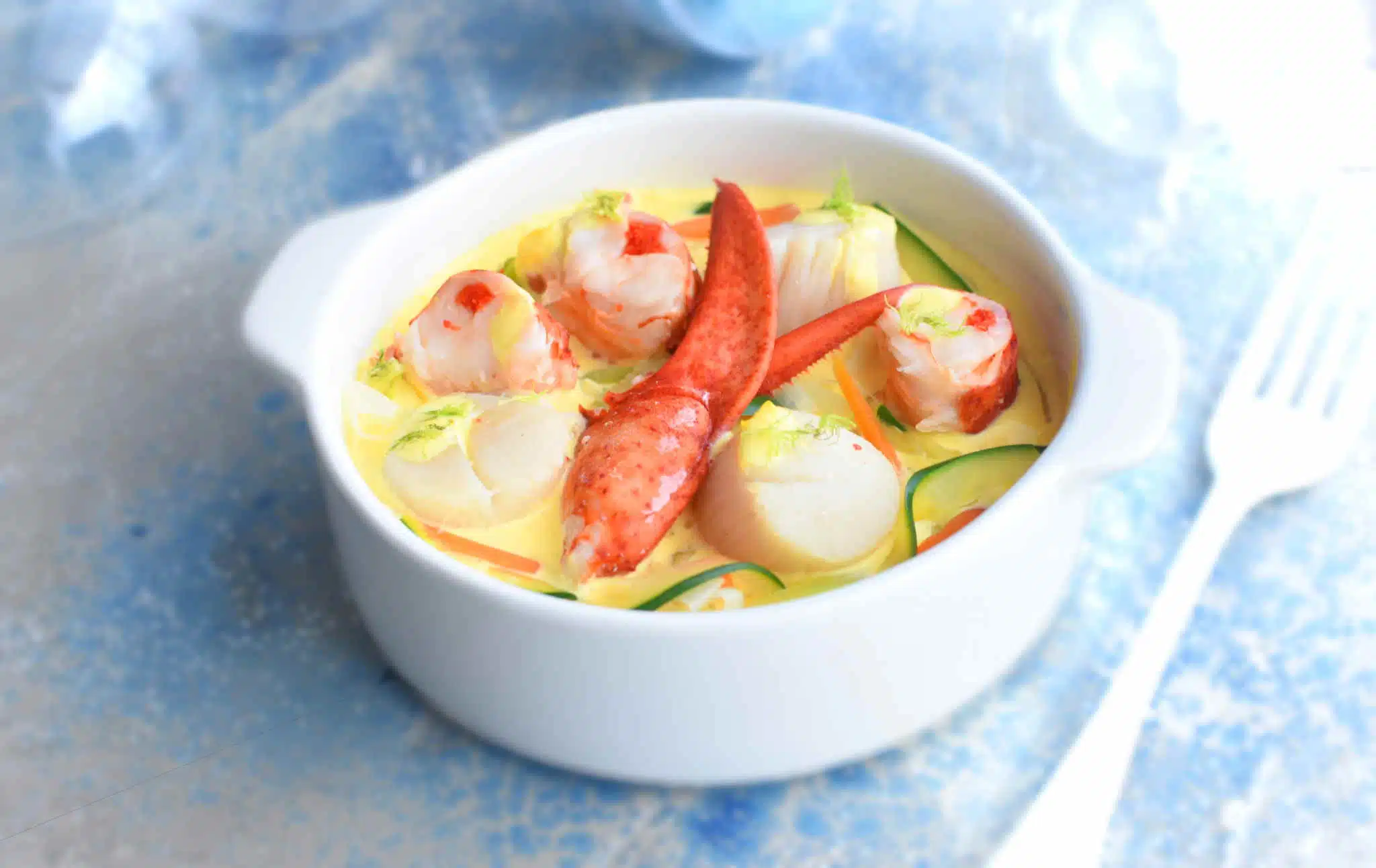 Cassolette de St Jacques et homard au champagne Primevere